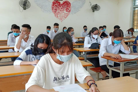 Thí sinh dự thi tốt nghiệp Trung học phổ thông. (Ảnh: Phạm Mai/Vietnam+)