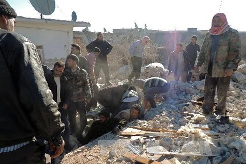 Hiện trường vụ tấn công ở Marea, ngoại ô Aleppo ngày 22/12. AFP/ TTXVN