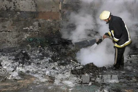 Hiện trường một vụ đánh bom ở Homs (Nguồn: AFP/TTXVN)