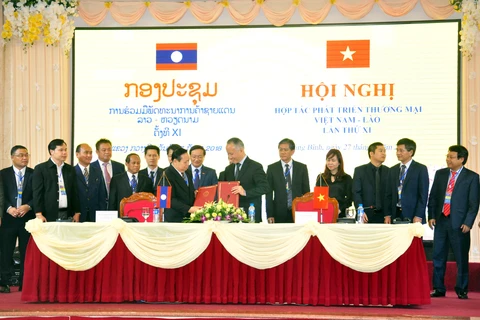 Hội nghị hợp tác phát triển thương mại biên giới Việt Nam-Lào lần thứ XI. (Ảnh: moit.gov.vn)