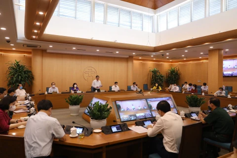 Thường trực Thành ủy Hà Nội họp với Ban Cán sự Đảng Ủy ban nhân dân thành phố Hà Nội về công tác phòng, chống COVID-19. (Ảnh: PV/Vietnam+).