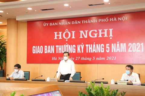 Ông Chu Ngọc Anh chủ trì phiên họp giao ban ban tập thể Ủy ban nhân dân thành phố Hà Nội tháng 5/2021. (Ảnh: PV/Vietnam+)