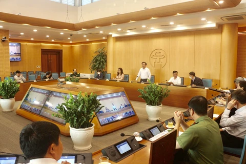 Cuộc họp của Ban Chỉ đạo phòng, chống dịch COVID-19 thành phố Hà Nội chiều 20/4. (Ảnh: PV/Vietnam+)