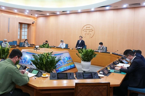 Phó Chủ tịch thành phố Hà Nội Chử Xuân Dũng chủ trì cuộc họp Ban Chỉ đạo phòng chống dịch COVID-19. (Ảnh: PV/Vietnam+)