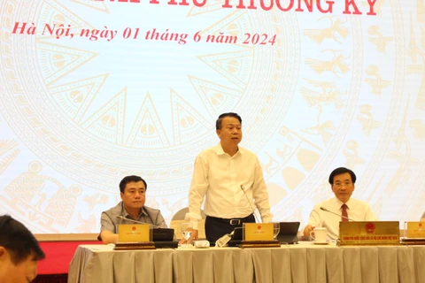 Thứ trưởng Bộ Tài chính Nguyễn Đức Chi thông tin với báo chí về quản lý thuế đối với lĩnh vực thương mại điện tử. (Ảnh: Đức Duy/Vietnam+)