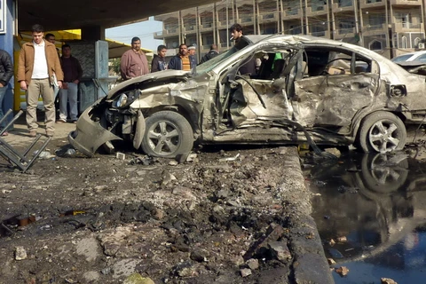 Hiện trường vụ đánh bom ở trung tâm Baghdad, ngày 15/1. (Nguồn: AFP/TTXVN)