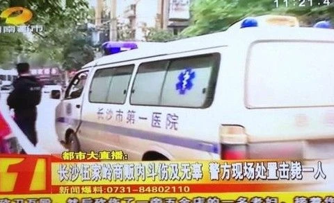 Đài truyền hình Hồ Nam đưa tin về vụ chém giết này. (Nguồn: 163.com)