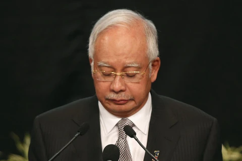 Thủ tướng Malaysia Najib Razak đau buồn thông báo chuyến bay MH370 đã đâm xuống Nam Ấn Độ Dương (Nguồn: Reuters)