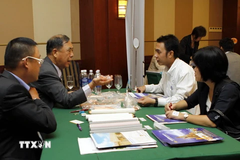 Các doanh nghiệp Việt Nam và Đài Loan thảo luận về khả năng hợp tác kinh doanh tại Chương trình giao lưu thương mại doanh nghiệp Việt Nam-Đài Loan năm 2013. (Ảnh: Hoàng Hải/Vietnam+)