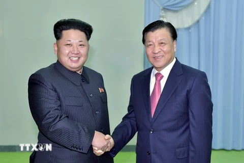 Ông Lưu Vân Sơn trong cuộc gặp với ông Kim Jong-Un. (Nguồn: THX/TTXVN)