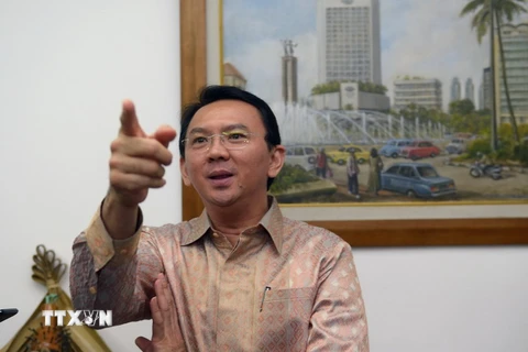 Thị trưởng thành phố Jakarta Basuki Tjahaja Purnama phát biểu trước báo giới tại thành phố Jakarta ngày 14/8/2014. (Nguồn: AFP/TTXVN)