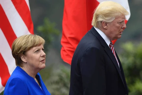Thủ tướng Đức Angela Merkel và Tổng thống Mỹ Donald Trump. (Nguồn: Daily Express)