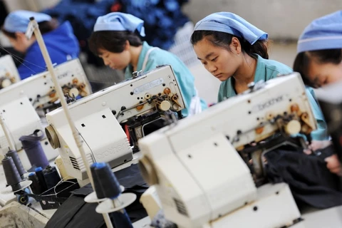 Công nhân trong một nhà máy ở Trung Quốc. (Nguồn: South China Morning Post)