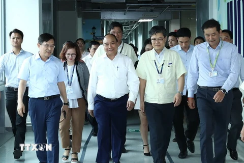 Thủ tướng Nguyễn Xuân Phúc đến thăm Công ty Samsung Electronics Việt Nam Thái Nguyên, tại thị xã Phổ Yên, tỉnh Thái Nguyên. (Ảnh: Thống Nhất/TTXVN)