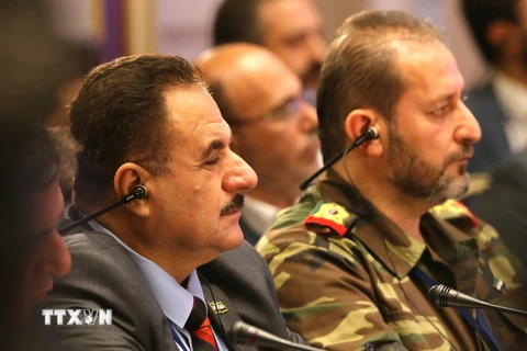 Đại diện phe đối lập Syria Ahmed Beri (trái) tại vòng đàm phán ở Astana ngày 15/9. (Nguồn: AFP/TTXVN)