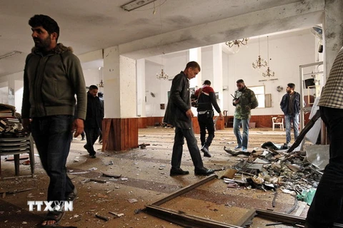 Hiện trường một vụ đánh bom tại Libya. (Nguồn: AFP/TTXVN)