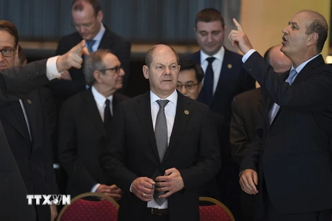 Bộ trưởng Tài chính Đức Olaf Scholz (giữa) tại hội nghị ngày 19/3. (Nguồn: AFP/TTXVN)