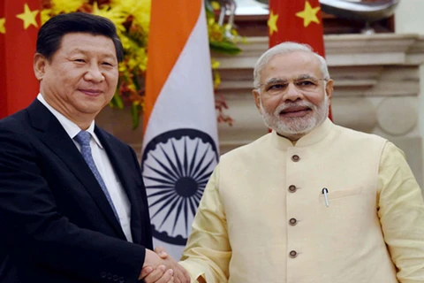 Chủ tịch Trung Quốc Tập Cận Bình (trái) và Thủ tướng Ấn Độ Narendra Modi. (Nguồn: PTI)