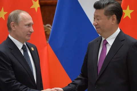 Tổng thống Nga Vladimir Putin (trái) và Chủ tịch Trung Quốc Tập Cận Bình. (Nguồn: sputniknews.com)