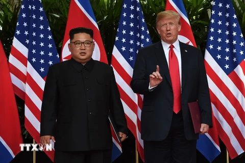 Nhà lãnh đạo Triều Tiên Kim Jong-un và Tổng thống Mỹ Donald Trump. (Nguồn: TTXVN)