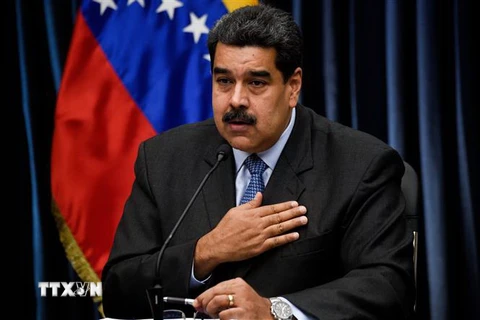 Tổng thống Venezuela Nicolas Maduro trong cuộc họp báo với truyền thông quốc tế sau chuyến thăm Trung Quốc, tại Caracas ngày 18/9. (Nguồn: AFP/TTXVN)