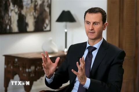 Tổng thống Syria Bashar al-Assad phát biếu với báo giới tại Damascus. (Nguồn: AFP/TTXVN) 