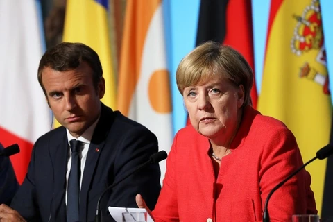 Tổng thống Pháp Emmanuel Macron (trái) và Thủ tướng Đức Angela Merkel. (Nguồn: kyivpost.com) 
