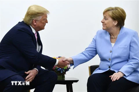 Tổng thống Mỹ Donald Trump (trái) và Thủ tướng Đức Angela Merkel (phải) tại cuộc hội đàm bên lề Hội nghị thượng đỉnh G20 ở Osaka, Nhật Bản ngày 28/6/2019. (Nguồn: AFP/TTXVN) 
