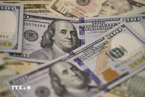 Đồng USD tại một ngân hàng ở Washington, DC, Mỹ. (Nguồn: THX/TTXVN) 