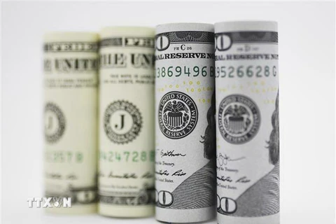 Đồng USD tại một ngân hàng ở Washington, DC. (Nguồn: THX/TTXVN) 