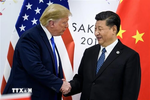 Tổng thống Mỹ Donald Trump (trái) trong cuộc gặp Chủ tịch Trung Quốc Tập Cận Bình tại Osaka, Nhật Bản ngày 29/6/2019. (Nguồn: AFP/TTXVN) 