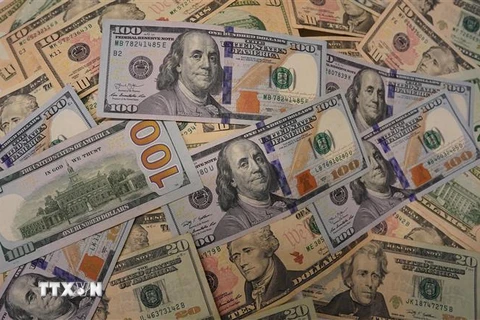 Đồng USD tại một ngân hàng ở Washington, DC. (Nguồn: THX/TTXVN)