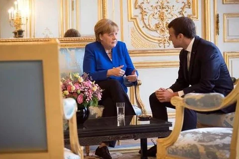 Tổng thống Pháp Emmanuel Macron và Thủ tướng Đức Angela Merkel. (Nguồn: ndtv.com) 