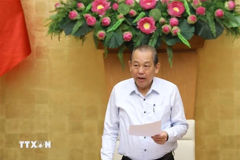 Phó Thủ tướng Thường trực Trương Hòa Bình chủ trì hội nghị. (Ảnh: Văn Điệp/TTXVN) 