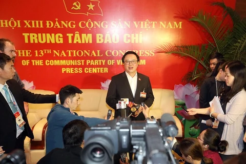 Đồng chí Hoàng Bình Quân, Ủy viên Trung ương Đảng, Trưởng ban Đối ngoại Trung ương, trả lời phỏng vấn các phóng viên tại Trung tâm báo chí (Nguồn: TTXVN)
