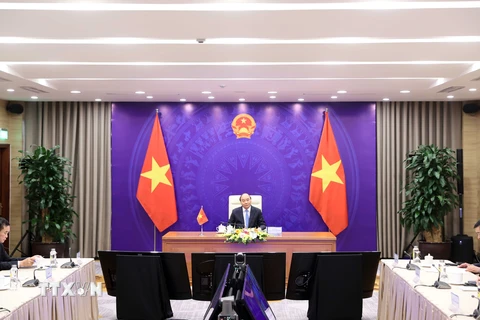 Hình ảnh Thủ tướng hội đàm trực tuyến với Lãnh đạo Lào và Campuchia