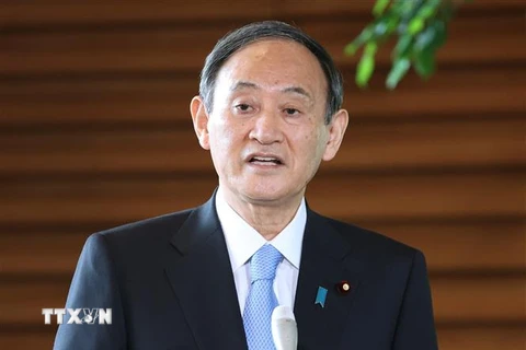 Thủ tướng Nhật Bản Suga Yoshihide phát biểu với báo giới tại Tokyo ngày 12/4/2021. (Nguồn: AFP/TTXVN) 