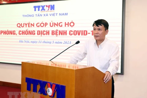 Tổng Giám đốc TTXVN Nguyễn Đức Lợi phát biểu. (Ảnh: Phạm Kiên/TTXVN) 