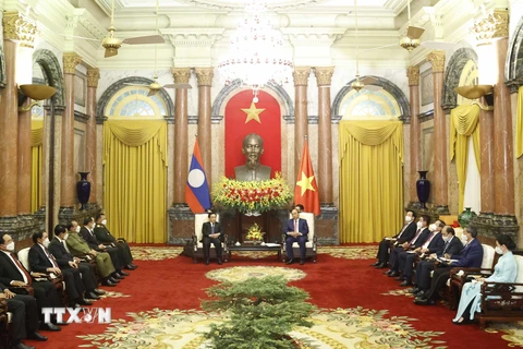 [Photo] Chủ tịch nước Nguyễn Xuân Phúc tiếp Thủ tướng Lào