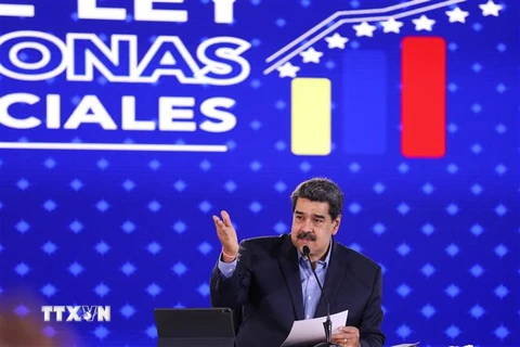Nhà lãnh đạo Venezuela Nicolas Maduro cũng tham gia cuộc tuần hành. (Ảnh: AFP/TTXVN) 