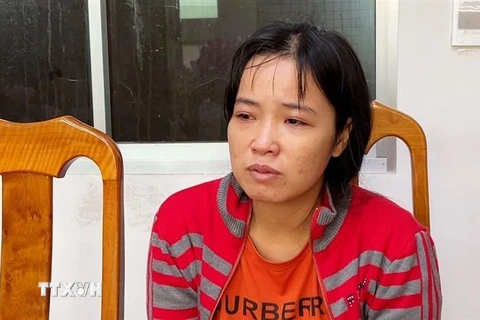 Đối tượng Nguyễn Thị Thương tại cơ quan điều tra. (Ảnh: TTXVN phát) 