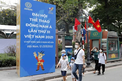 Trong ảnh: Biểu ngữ chào SEA Games 31 trên phố Lê Thạch. Ảnh: Trần Việt - TTXVN 