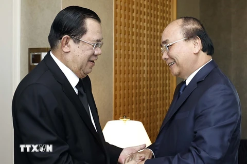 Chủ tịch nước Nguyễn Xuân Phúc gặp Thủ tướng Campuchia Samdech Techno Hun Sen. (Ảnh: Thống Nhất/TTXVN) 