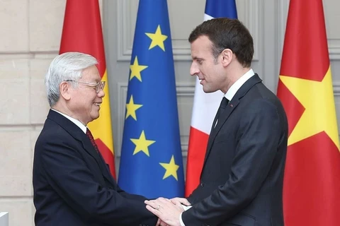 Tổng thống Emmanuel Macron đón và hội đàm với Tổng Bí thư Nguyễn Phú Trọng thăm chính thức Cộng hòa Pháp (Paris, 27/3/2018). (Ảnh: Trí Dũng/TTXVN)