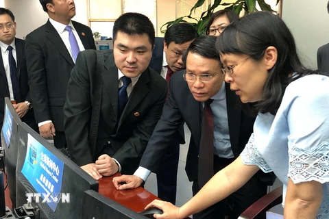 Tổng Giám đốc Thông tấn xã Việt Nam Nguyễn Đức Lợi thăm và làm việc tại Trung Quốc. (Nguồn: TTXVN)
