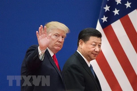 Tổng thống Mỹ Donald Trump (trái) và Chủ tịch Trung Quốc Tập Cận Bình trong cuộc gặp tại Bắc Kinh (Trung Quốc). (Nguồn: AFP/TTXVN)