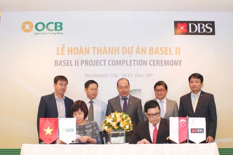 Lễ ký kết nghiệm thu hoàn thành dự án Basel II giữa lãnh đạo OCB và Ngân hàng Phát triển Singapore. (Nguồn: OCB)