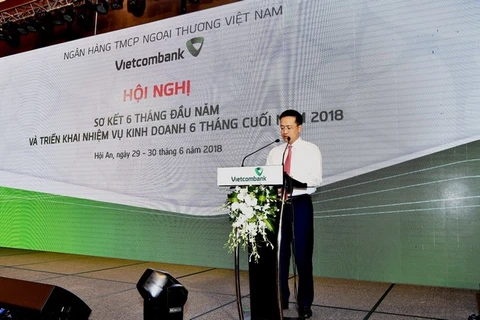 Tổng giám đốc Vietcombank Phạm Quang Dũng báo cáo kết quả hoạt động kinh doanh tại hội nghị. (Nguồn: Vietcombank)