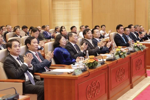 Thống đốc Ngân hàng Nhà nước Lê Minh Hưng cùng các đại biểu tam dự hội nghị. (Ảnh: CTV/Vietnam+)