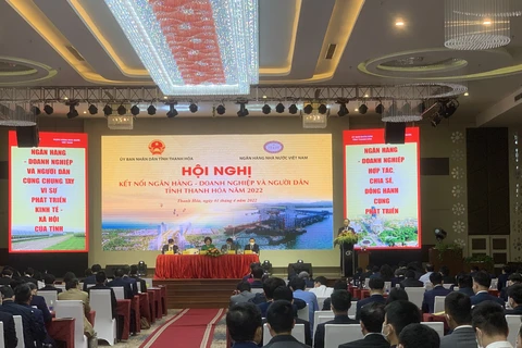Lãnh đạo Ngân hàng Nhà nước và Ủy ban Nhân dân tỉnh Thanh Hóa chủ trì hội nghị. (Ảnh: Vietnam+)